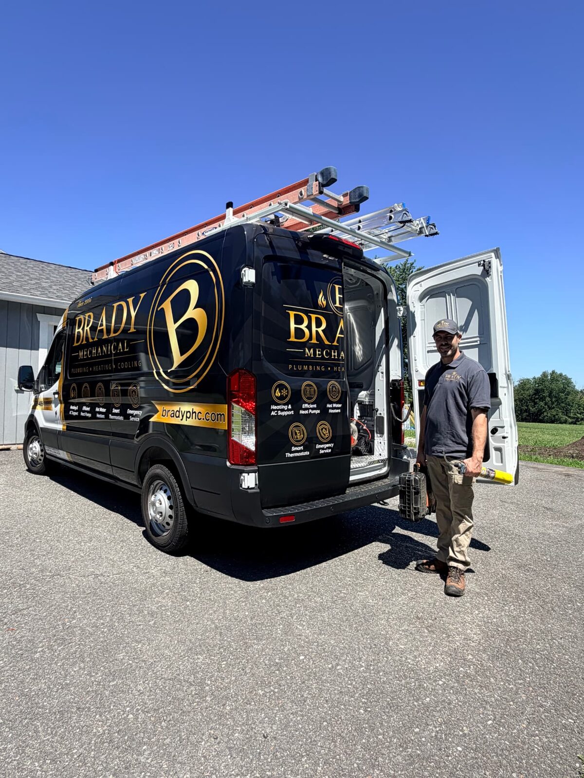 Brady Mechanical owner with the company service van in Pepperell, MA